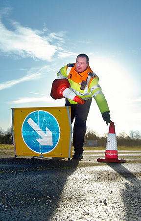 Traffic Officer places cones around RTA road traffic accident